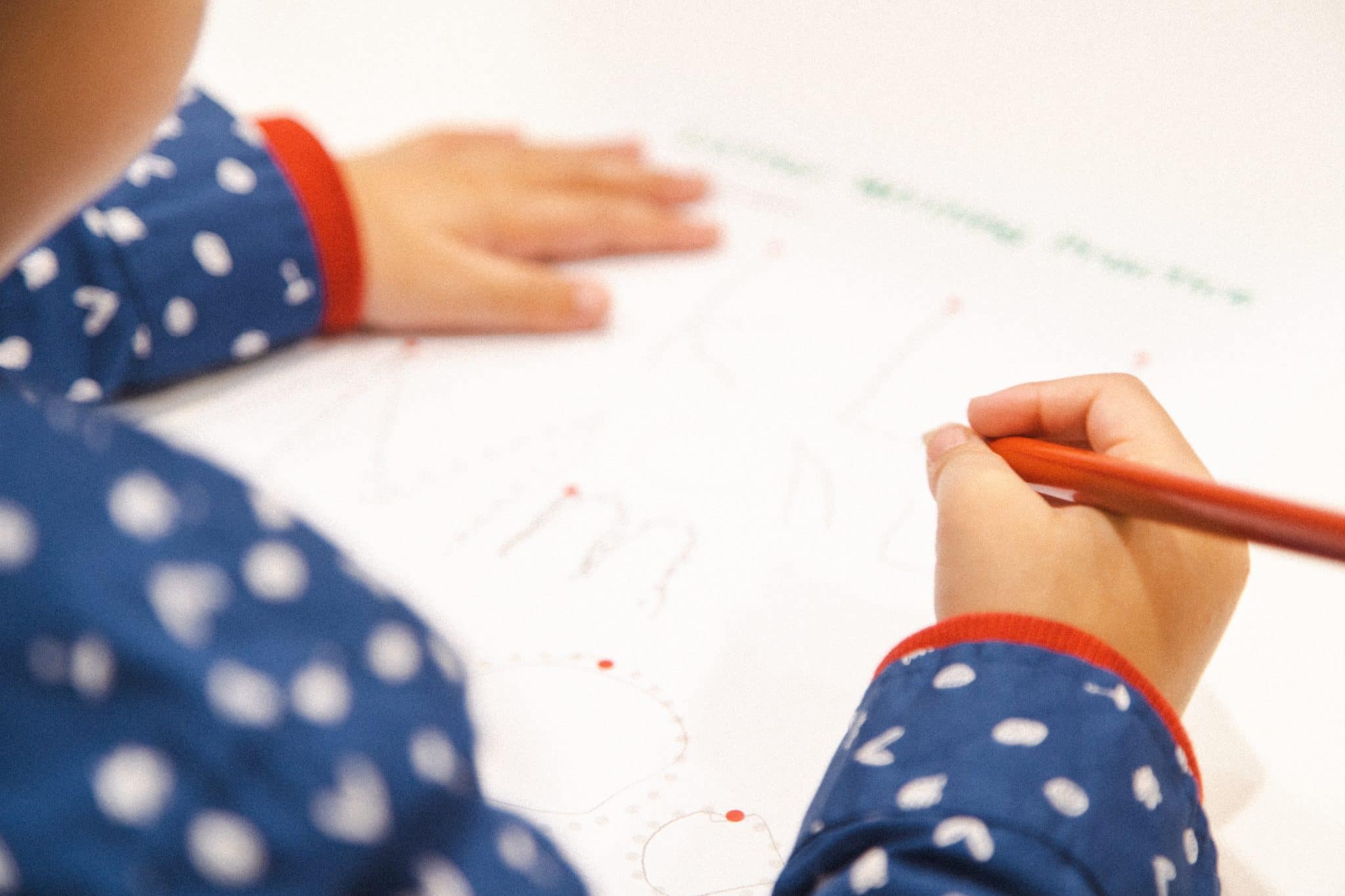 Transitioning To Kinder - young child practicing writing in a Shichida class