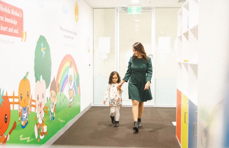 Early Learning Centre Australia, a mum walking into a Shichida centre, holding the hand of her preschool daughter