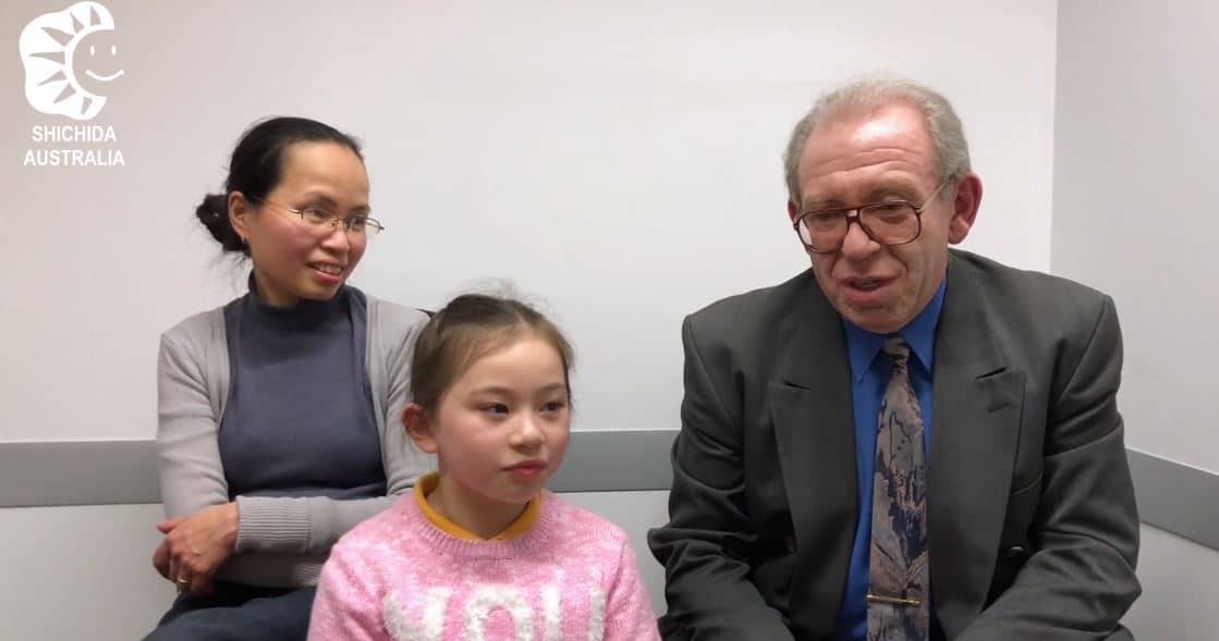 A dad, mum and young girl in a Shichida centre, giving a testimonial regarding their daughters amazing learning journey