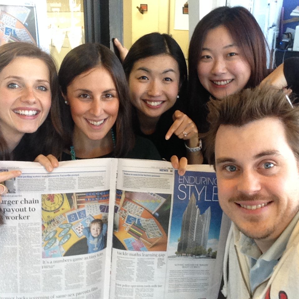 Staff excited about the featured news article in The Age, showcasing a Shichida student in the article "Numbers Game"
