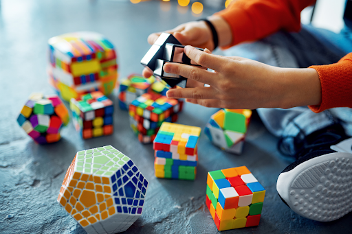Problem Solving for preschoolers, a child playing with Rubik's cubes