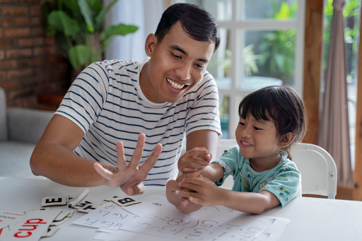 Concentration and Focus in Children: Dad and daughter doing numeracy practice