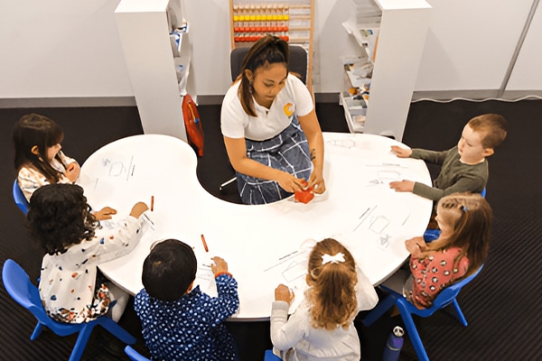 Learning sequence: The order of acquisition in early learning is crucial to development, shown here by a Shichida teachers handing out crayons during a class for preschoolers