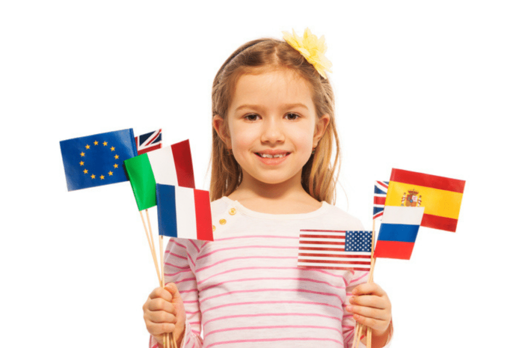 Benefits of Raising Multilingual Kids: A young girl with several national flags of different countries