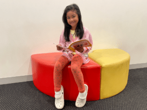 Happy Shichida child reading a book