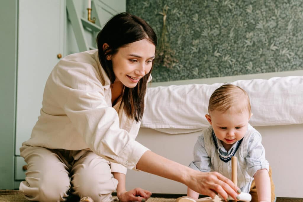 Mum and baby playing. A parents is a child's first teacher.