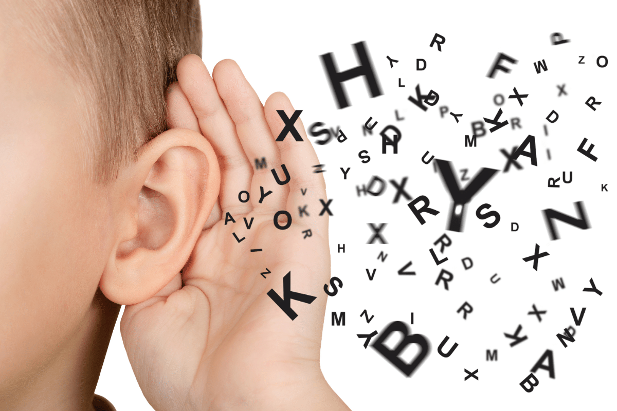 A child cupping his ear with alphabet letter graphics seemingly coming from his ear, demonstrating the concept of teaching kids active listening skills