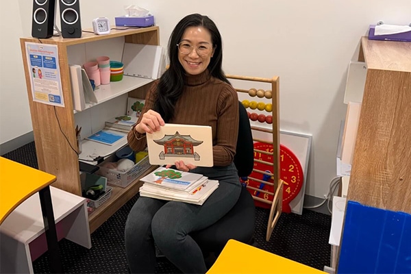 Teacher using high-speed flashcards in a Shichida class