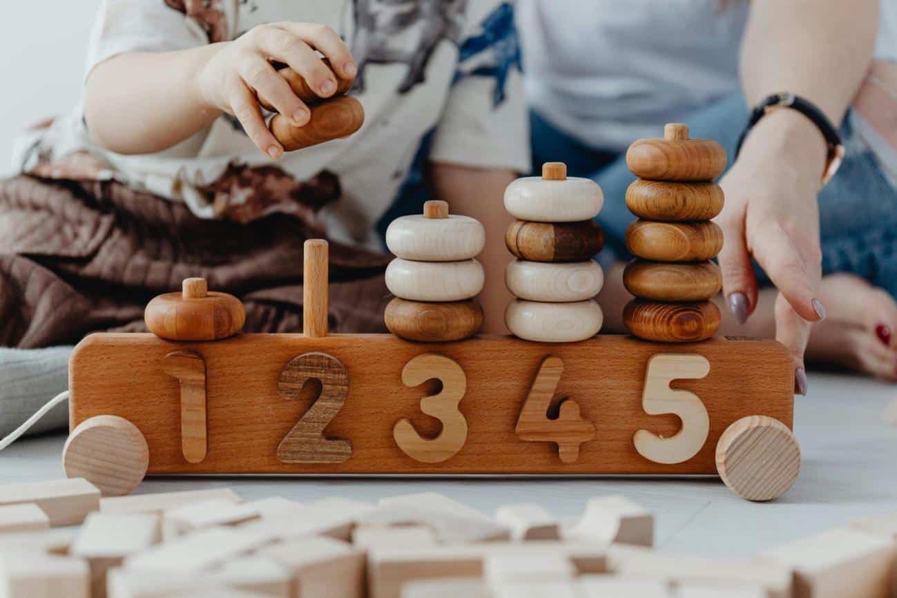 Numeracy activities for preschoolers being taught through a stacking game
