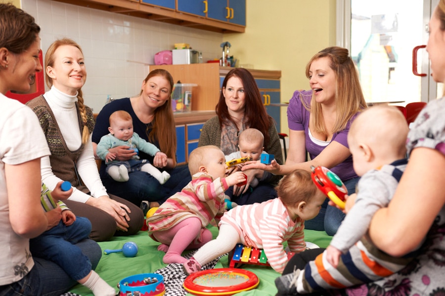 Parenting styles, featuring a group of parents and babies at a playgroup.