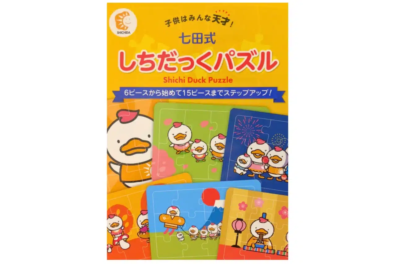 A Japanese card game featuring an illustration of a duck alongside a child, showcasing playful interaction