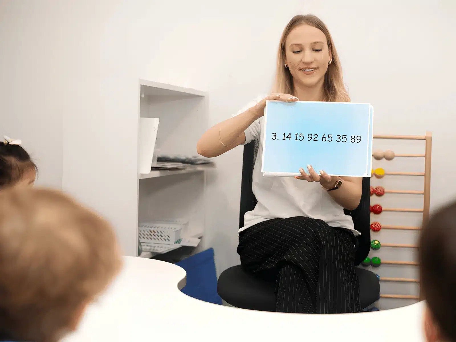 Children memorising digits of Pi using flashcards