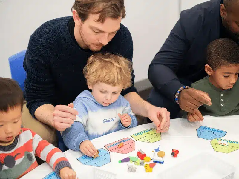 A hands-on learning moment where young children build focus, problem-solving skills and confidence through guided, play-based activities with parent support