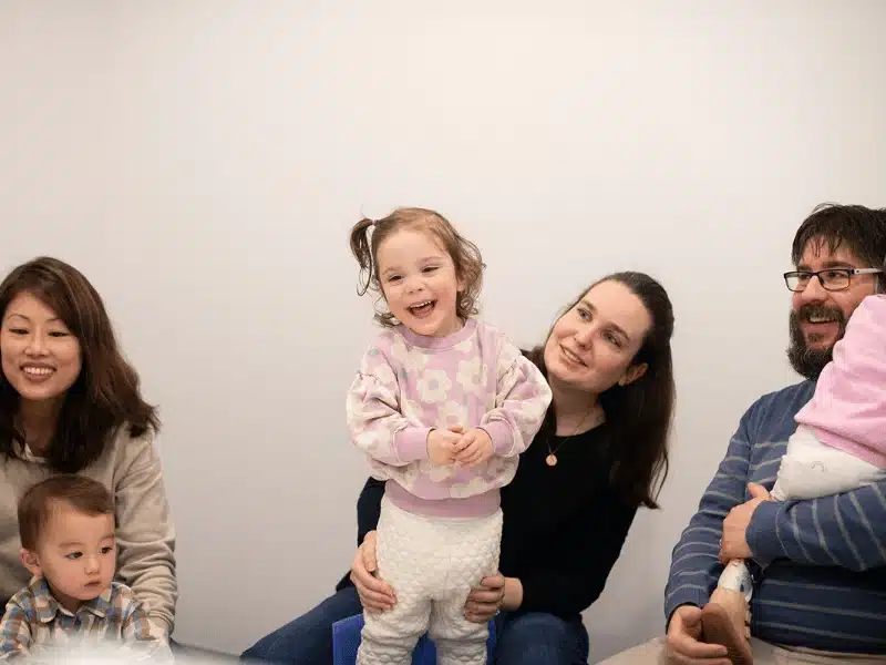 Parents and toddlers spending quality time together during a Shichida class, where they play educational games and activities together.