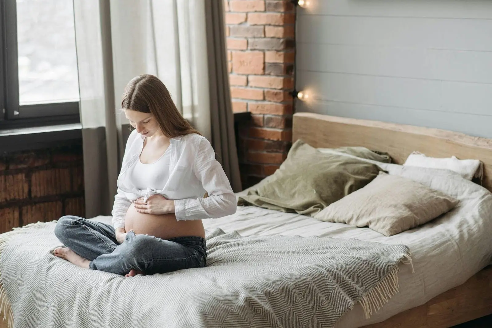 Pregnant Woman on Bed - Pregnancy Milestones