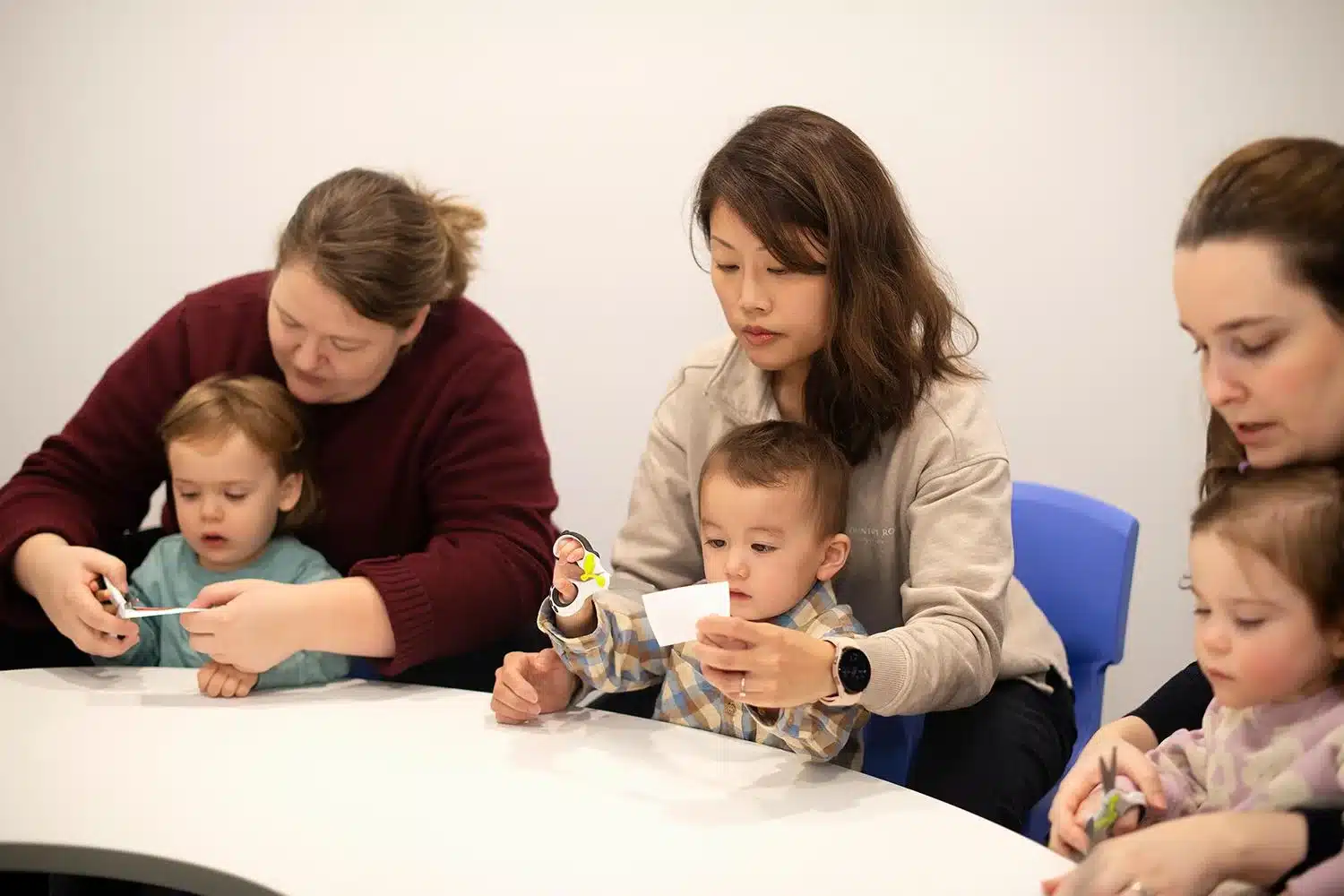 parents with kids in a Shichida class - How to Improve Attention Span in Children